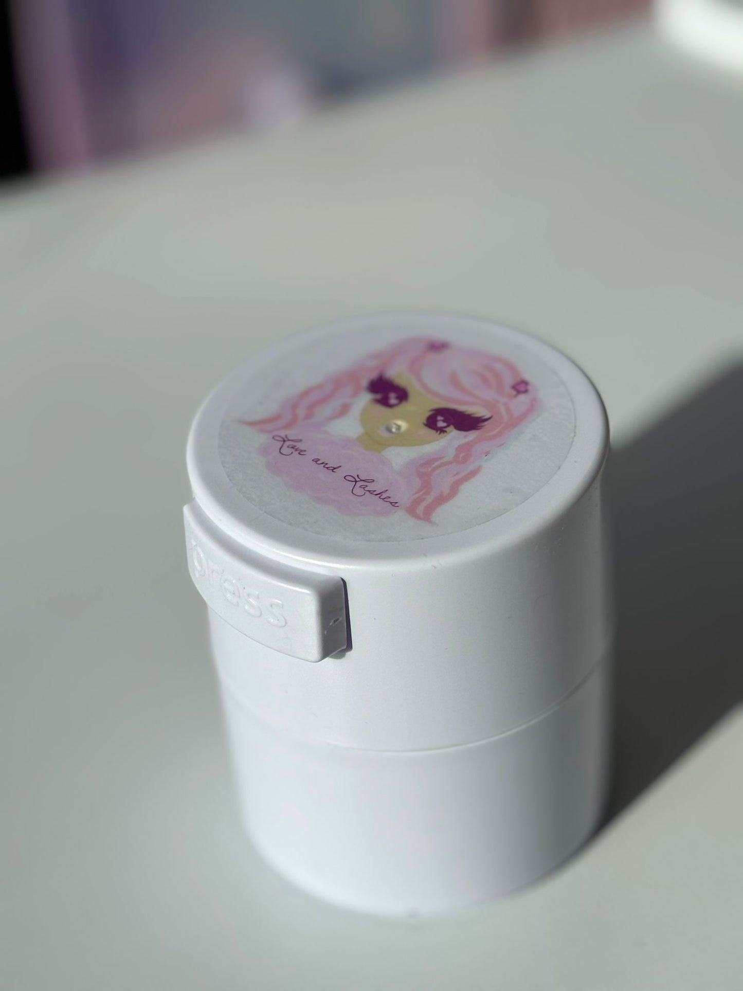 Adhesive storage container vacuum sealed