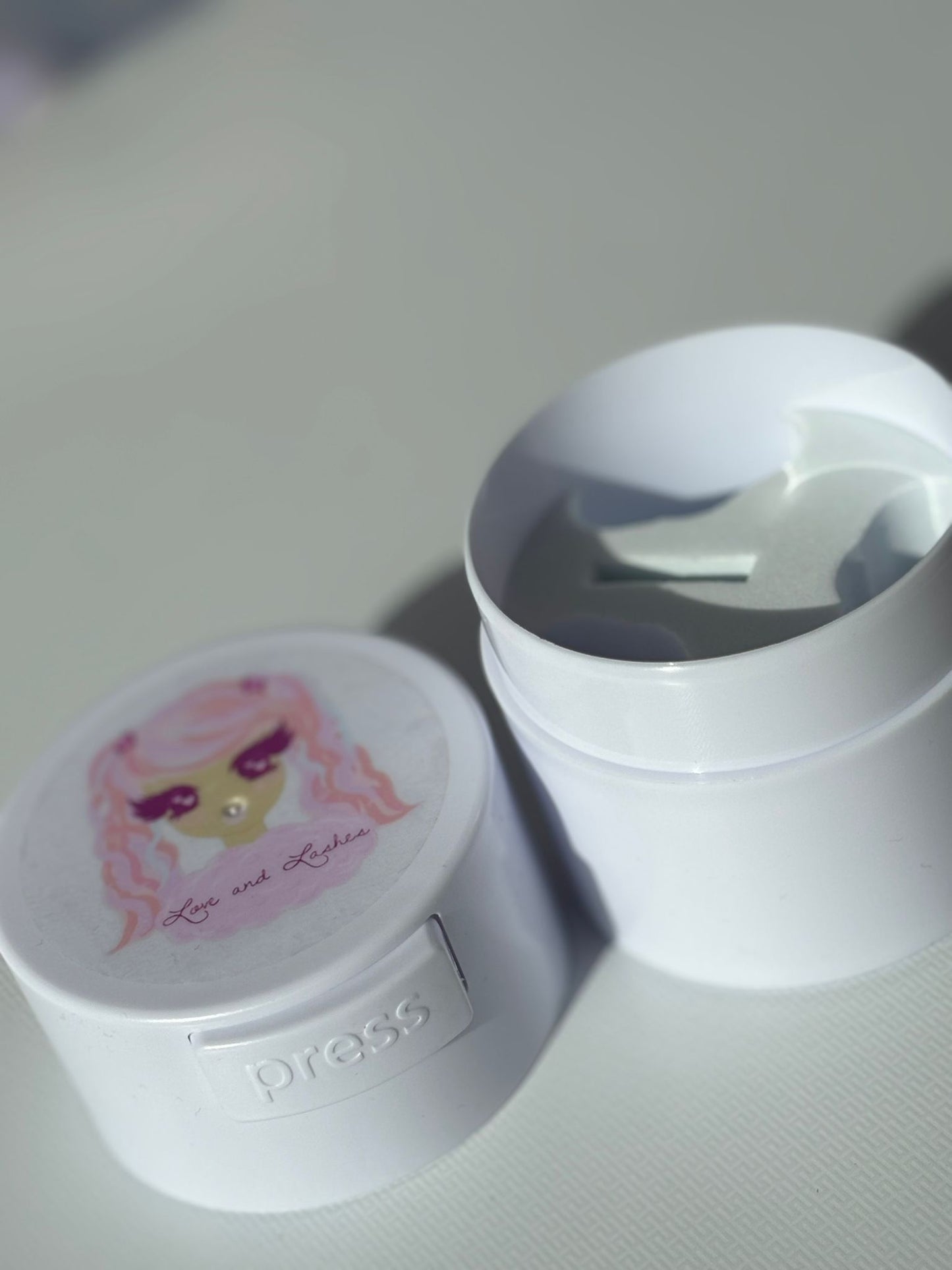 Adhesive storage container vacuum sealed