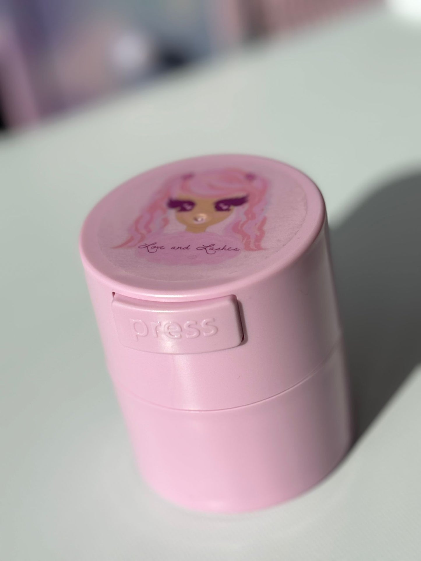 Adhesive storage container vacuum sealed